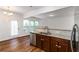 Stylish kitchen featuring granite countertops, stainless steel appliances, and lots of natural light at 4150 Cedar Bridge Walk, Suwanee, GA 30024