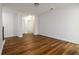 Spacious living room with beautiful hardwood floors, neutral colors, and lots of natural light at 4150 Cedar Bridge Walk, Suwanee, GA 30024