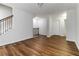 Open-concept living room featuring beautiful floors and staircase to the upper level at 4150 Cedar Bridge Walk, Suwanee, GA 30024