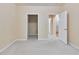 Carpeted bedroom featuring neutral walls, multiple closets, and access to other rooms at 4333 Dunwoody Park # 2107, Atlanta, GA 30338