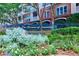 Landscaped entrance to the 'The Terraces of Dunwoody' condominium community sign, surrounded by colorful foliage at 4333 Dunwoody Park # 2107, Atlanta, GA 30338