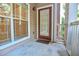 View of the entry door with a window, white trim, and a small porch area, offering a welcoming entrance at 4333 Dunwoody Park # 2107, Atlanta, GA 30338