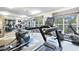 Bright fitness center featuring modern equipment, weights, treadmills and exercise bikes with mirrors and natural lighting at 4333 Dunwoody Park # 2107, Atlanta, GA 30338