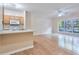 Open floor plan features a kitchen with bar seating flowing into a bright living area at 4333 Dunwoody Park # 2107, Atlanta, GA 30338