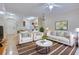 Inviting living room with hardwood floors, comfortable seating, and an adjacent eat-in kitchen at 4333 Dunwoody Park # 2107, Atlanta, GA 30338