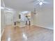 Spacious living space with hardwood floors connecting to an eat-in kitchen with white appliances at 4333 Dunwoody Park # 2107, Atlanta, GA 30338