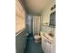 Compact bathroom featuring a shower, toilet, sink and blue tiles at 4416 Arcadia Dr, Norcross, GA 30093