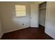 Small bedroom featuring dark laminate flooring and a closet at 4416 Arcadia Dr, Norcross, GA 30093