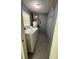 Functional laundry room with a washer, dryer, and storage shelving at 4416 Arcadia Dr, Norcross, GA 30093