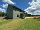 A sprawling backyard with green lawn and patio, with plenty of space for outdoor enjoyment at 5377 Heron Bay Blvd, Locust Grove, GA 30248