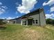 A spacious backyard with a covered patio, offering a versatile outdoor living space and tranquil views at 5377 Heron Bay Blvd, Locust Grove, GA 30248
