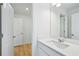 Bathroom featuring a single vanity with stylish fixtures and an adjacent doorway to the bathroom at 5377 Heron Bay Blvd, Locust Grove, GA 30248