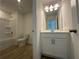 Bathroom featuring tile flooring, a modern vanity, and a shower-tub combo at 5377 Heron Bay Blvd, Locust Grove, GA 30248