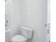 Bright bathroom featuring a toilet, bathtub with shower, and white walls at 5377 Heron Bay Blvd, Locust Grove, GA 30248
