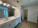 Bathroom featuring double sinks, a soaking tub, and a separate shower at 5377 Heron Bay Blvd, Locust Grove, GA 30248