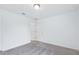 Light-filled bedroom with soft carpet, and easy access to adjacent rooms through several doors at 5377 Heron Bay Blvd, Locust Grove, GA 30248