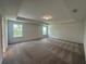 Large bedroom with tray ceiling, neutral carpet, and great natural light at 5377 Heron Bay Blvd, Locust Grove, GA 30248