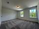 Bright bedroom with plush carpeting, natural light from large windows, and ample space at 5377 Heron Bay Blvd, Locust Grove, GA 30248