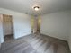 A serene bedroom with carpet, closet, and ensuite, designed for comfortable, modern living at 5377 Heron Bay Blvd, Locust Grove, GA 30248