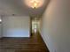 Hallway with hardwood floors, neutral walls, recessed lighting, and views into other rooms at 5377 Heron Bay Blvd, Locust Grove, GA 30248