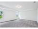 Spacious, carpeted main bedroom featuring recessed lighting and tray ceiling at 5377 Heron Bay Blvd, Locust Grove, GA 30248