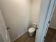 Powder room with neutral finishes at 5377 Heron Bay Blvd, Locust Grove, GA 30248
