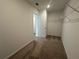 Bright walk-in closet featuring neutral carpet, wire shelving, and access to additional storage space at 5377 Heron Bay Blvd, Locust Grove, GA 30248