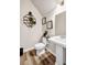 Nicely decorated half bathroom with stylish shelving and a modern pedestal sink at 7884 Rock Rose Ln, Fairburn, GA 30213