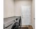 The laundry room features modern appliances and easy access to an exterior door at 7884 Rock Rose Ln, Fairburn, GA 30213