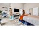A spacious main bedroom with an ensuite, decorative dresser, and a dedicated office space at 7884 Rock Rose Ln, Fairburn, GA 30213