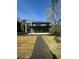 Spacious backyard with a patio and a walkway made of black mulch at 1921 Herbert Dr, Tucker, GA 30084