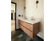 Modern bathroom featuring double vanity with wood cabinets and modern fixtures at 1921 Herbert Dr, Tucker, GA 30084