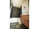 Sleek bathroom with dark tile shower, modern vanity, and unique hexagonal floor tiles at 1921 Herbert Dr, Tucker, GA 30084