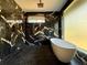 Luxurious bathroom featuring marble tile, soaking tub, and modern fixtures at 1921 Herbert Dr, Tucker, GA 30084