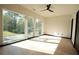 Sun-filled bedroom with large windows offering scenic views and light wood floors at 1921 Herbert Dr, Tucker, GA 30084