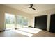 Bright bedroom with large windows, ceiling fan, and wood floors at 1921 Herbert Dr, Tucker, GA 30084
