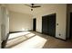 Well-lit bedroom with hardwood floors, ceiling fan, and black trim at 1921 Herbert Dr, Tucker, GA 30084