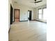 Spacious bedroom with light wood floors, ceiling fan, and multiple windows at 1921 Herbert Dr, Tucker, GA 30084