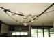 Unique chandelier with silver globe lights adding style to the living room and kitchen at 1921 Herbert Dr, Tucker, GA 30084
