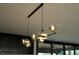 Modern chandelier with glass globe lights illuminating the kitchen area at 1921 Herbert Dr, Tucker, GA 30084