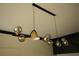 Unique chandelier with chrome and brass accents above a modern kitchen at 1921 Herbert Dr, Tucker, GA 30084