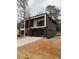 Beautiful two-story home with a black garage and modern design at 1921 Herbert Dr, Tucker, GA 30084