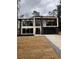 Modern two-story home featuring a balcony and large windows at 1921 Herbert Dr, Tucker, GA 30084