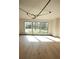 Bright, open-plan living room featuring large windows and light hardwood flooring at 1921 Herbert Dr, Tucker, GA 30084