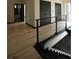 View of the upstairs hallway looking down to modern staircase and downstairs area at 1921 Herbert Dr, Tucker, GA 30084