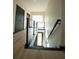 Modern staircase with metal railing and light wood floors at 1921 Herbert Dr, Tucker, GA 30084