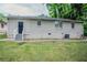 Backyard view of home and outdoor space, showing grassy area and side door at 2529 Habersham Dr, Decatur, GA 30032