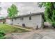 Home's exterior and backyard featuring green space, brick, and side entrance at 2529 Habersham Dr, Decatur, GA 30032