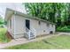 View of the home's backyard with green grass and stairs leading to back entrance at 2529 Habersham Dr, Decatur, GA 30032