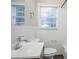 Bright bathroom featuring tiled walls, modern fixtures, and a window at 2529 Habersham Dr, Decatur, GA 30032